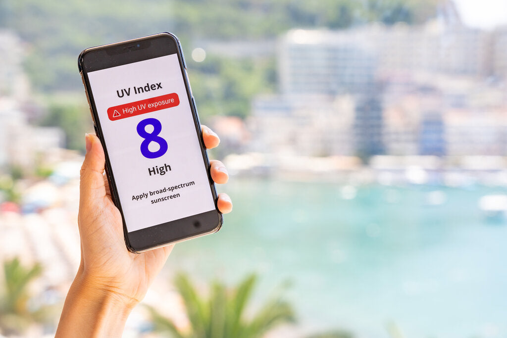 Phone showing a UV Index of 8 with a very high exposure warning, demonstrating how the UV Index helps people stay safe in the sun.