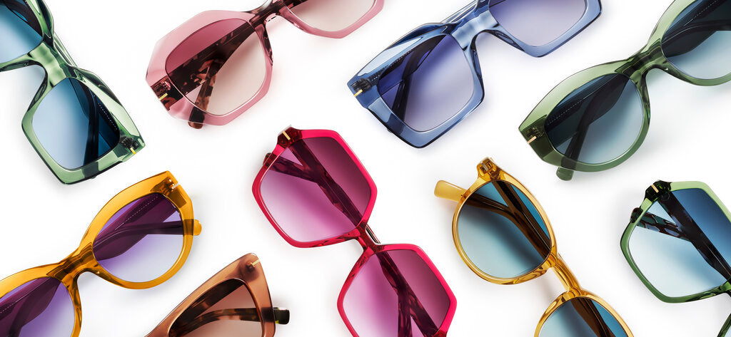 Assortment of colorful sunglasses with different lens tints, illustrating how lens categories and UV protection vary for different lighting conditions